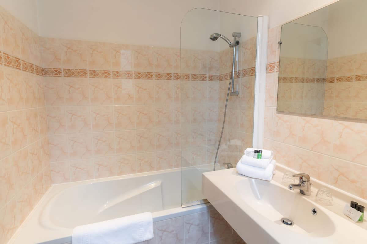 superior double room | bathroom | free toiletries, hair dryer, towels