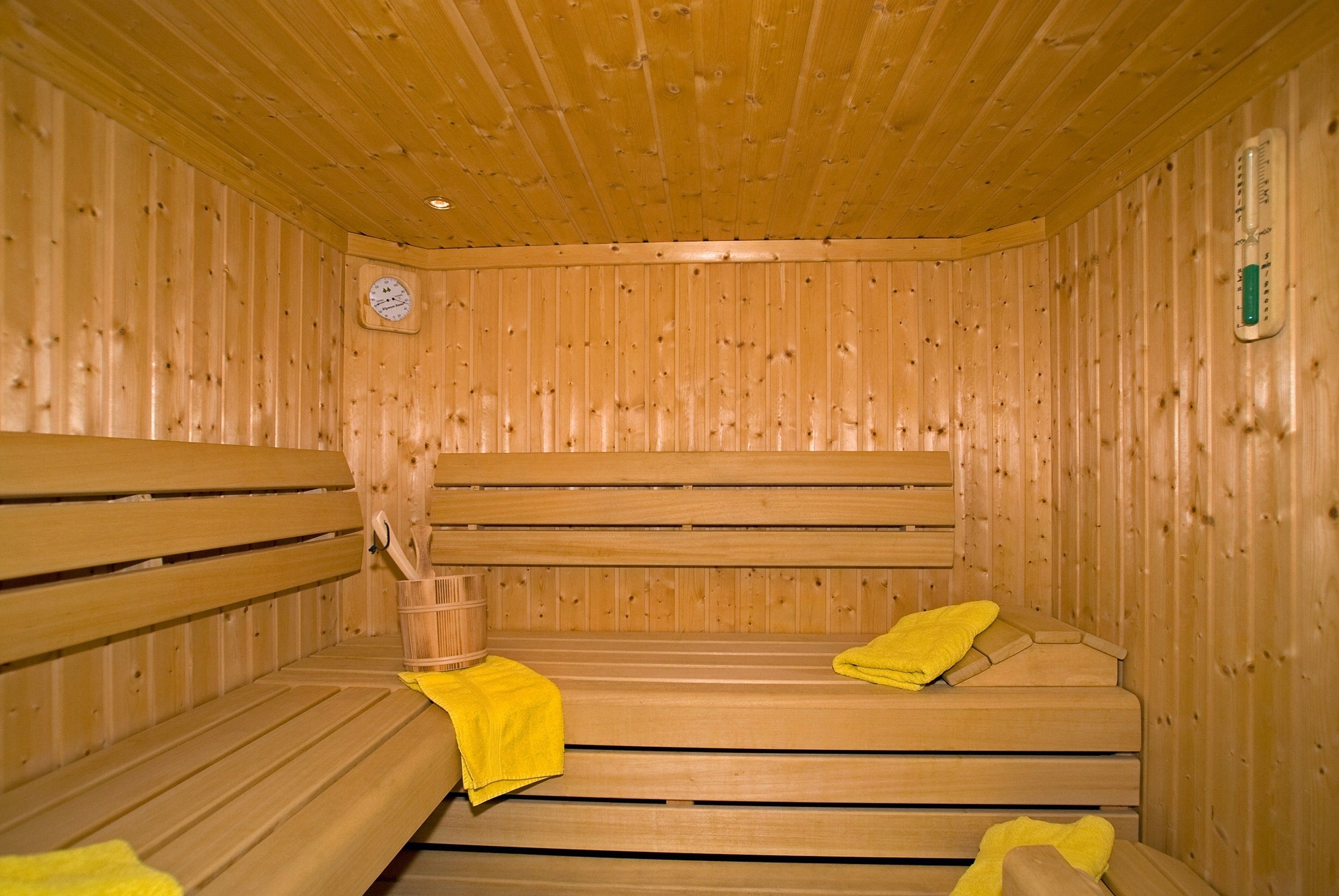 A wooden sauna with benches and benches.