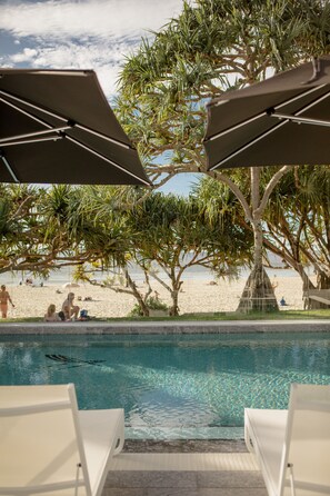 Outdoor pool, open 8:00 AM to 8:00 PM, pool umbrellas, sun loungers