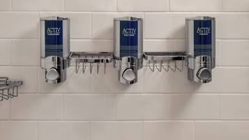 Shower, designer toiletries, hair dryer, towels