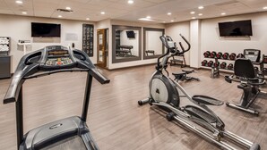 A gym with treadmills, elliptical machines, and weight machines. - Best Western Plus Champaign/Urbana Inn (Champaign)