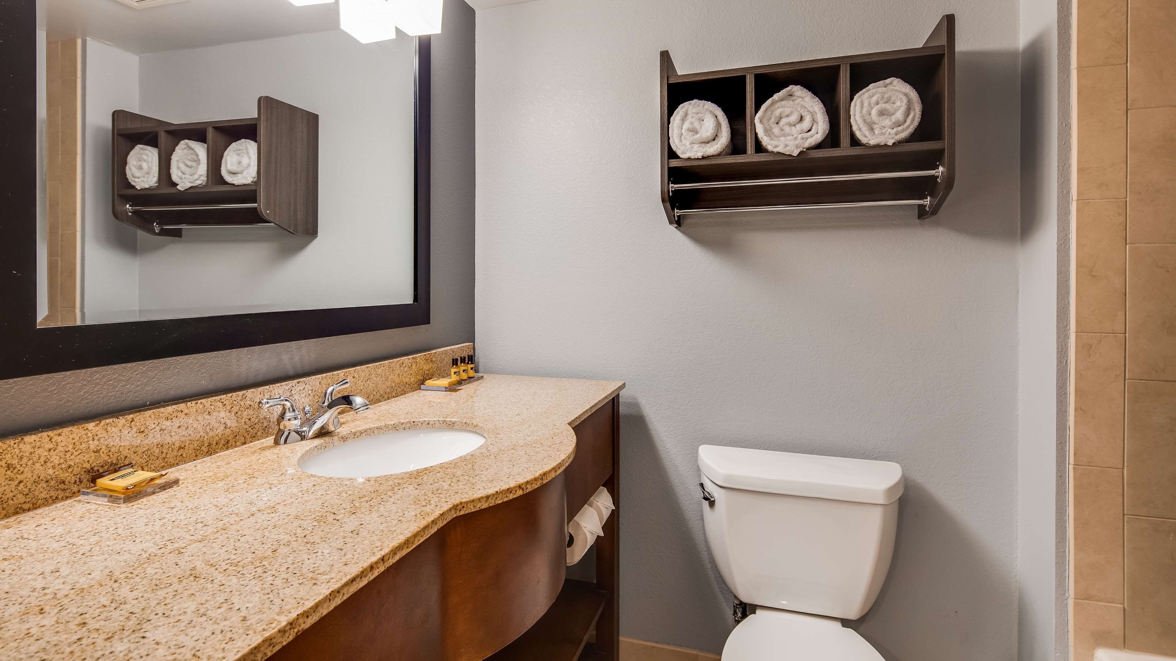 combined shower/bathtub, designer toiletries, hair dryer, towels