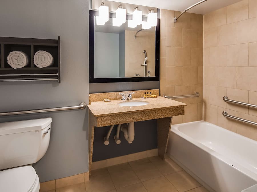 Combined shower/bathtub, designer toiletries, hair dryer, towels