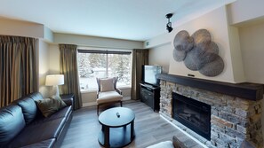CP # 4208 Two Bedroom + Den, Two story | Living room | 42-inch flat-screen TV with satellite channels, TV, fireplace - Copperstone Resort (Dead Man's Flats)