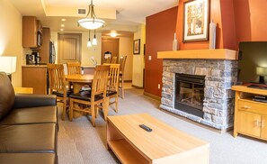 CP One Bedroom | Living area | 42-inch flat-screen TV with satellite channels, TV, fireplace - Copperstone Resort (Dead Man's Flats)