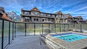 A pool area with a clear view of a mountain in the background.