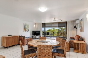 42-inch flat-screen TV with cable channels, LCD TV, DVD player - Roydon Beachfront Apartments (Trinity Beach)