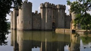 A historic stone castle with multiple towers and a moat. - Grand Hastings (St Leonards-On-Sea)