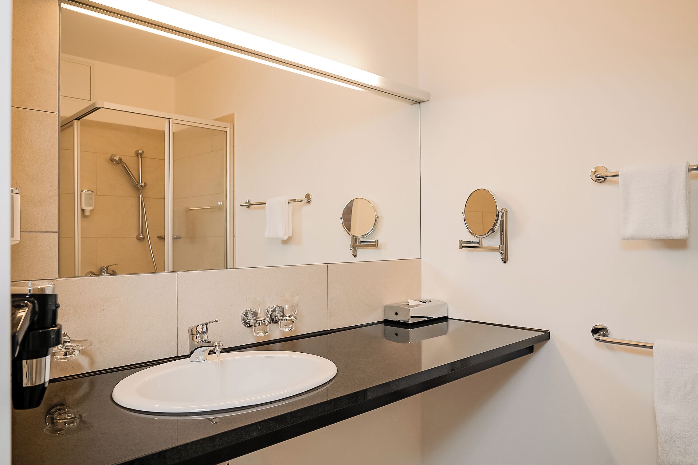 shower, hair dryer, heated floors, towels