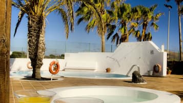 Outdoor pool, pool umbrellas, sun loungers
