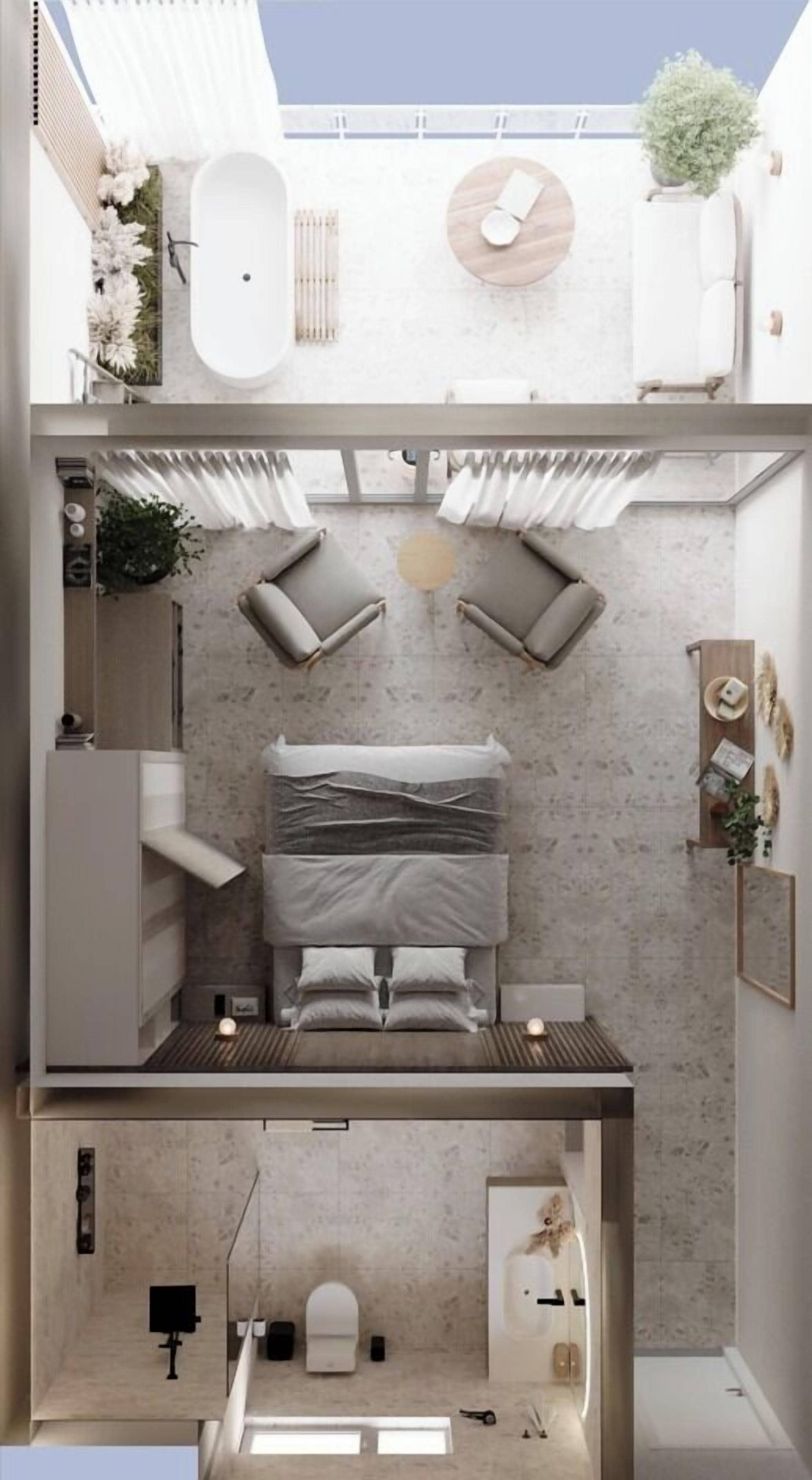 A compact, modern apartment with a bed, seating area, and a small bathroom.