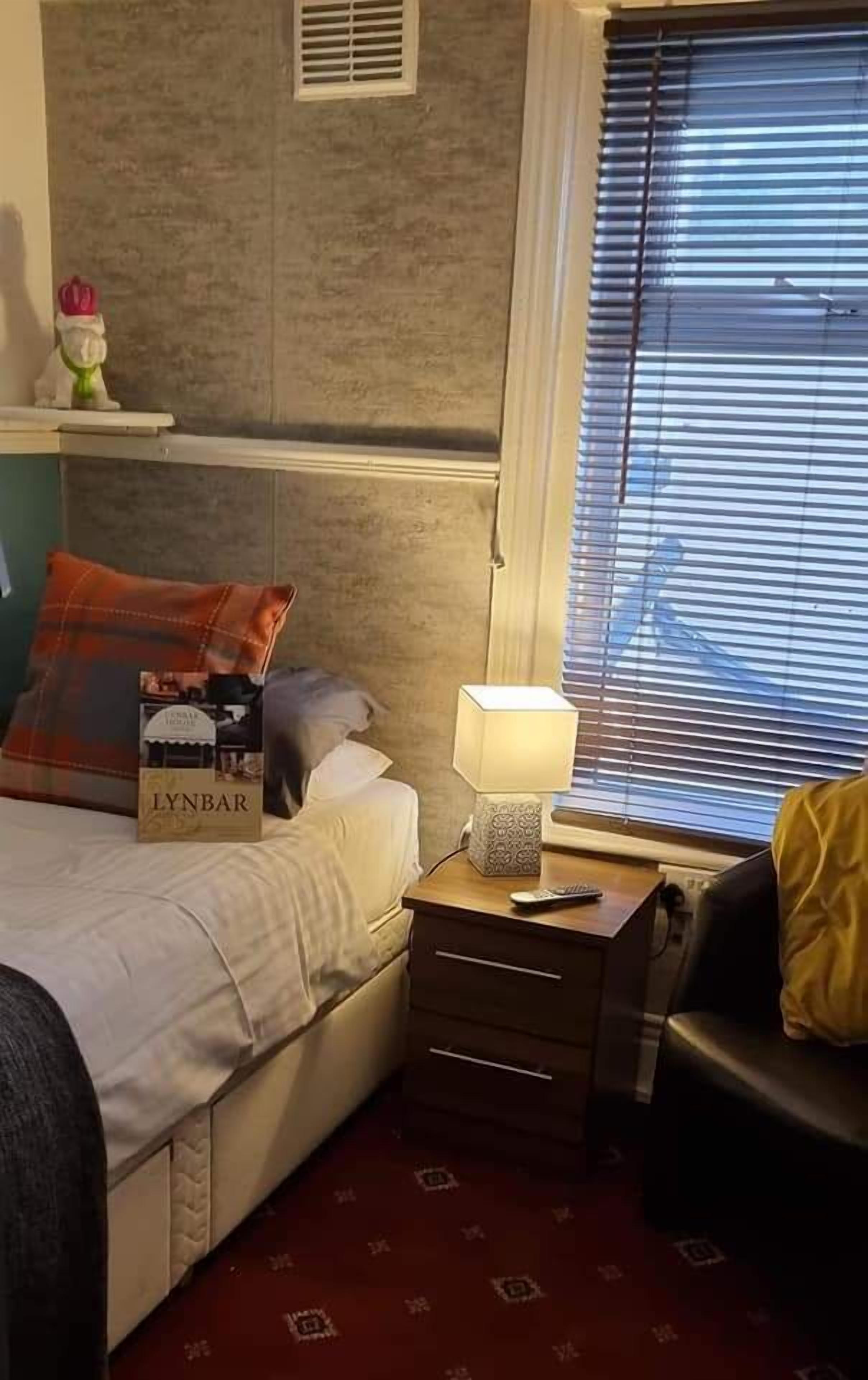 room 5 | laptop workspace, blackout curtains, iron/ironing board, travel cot