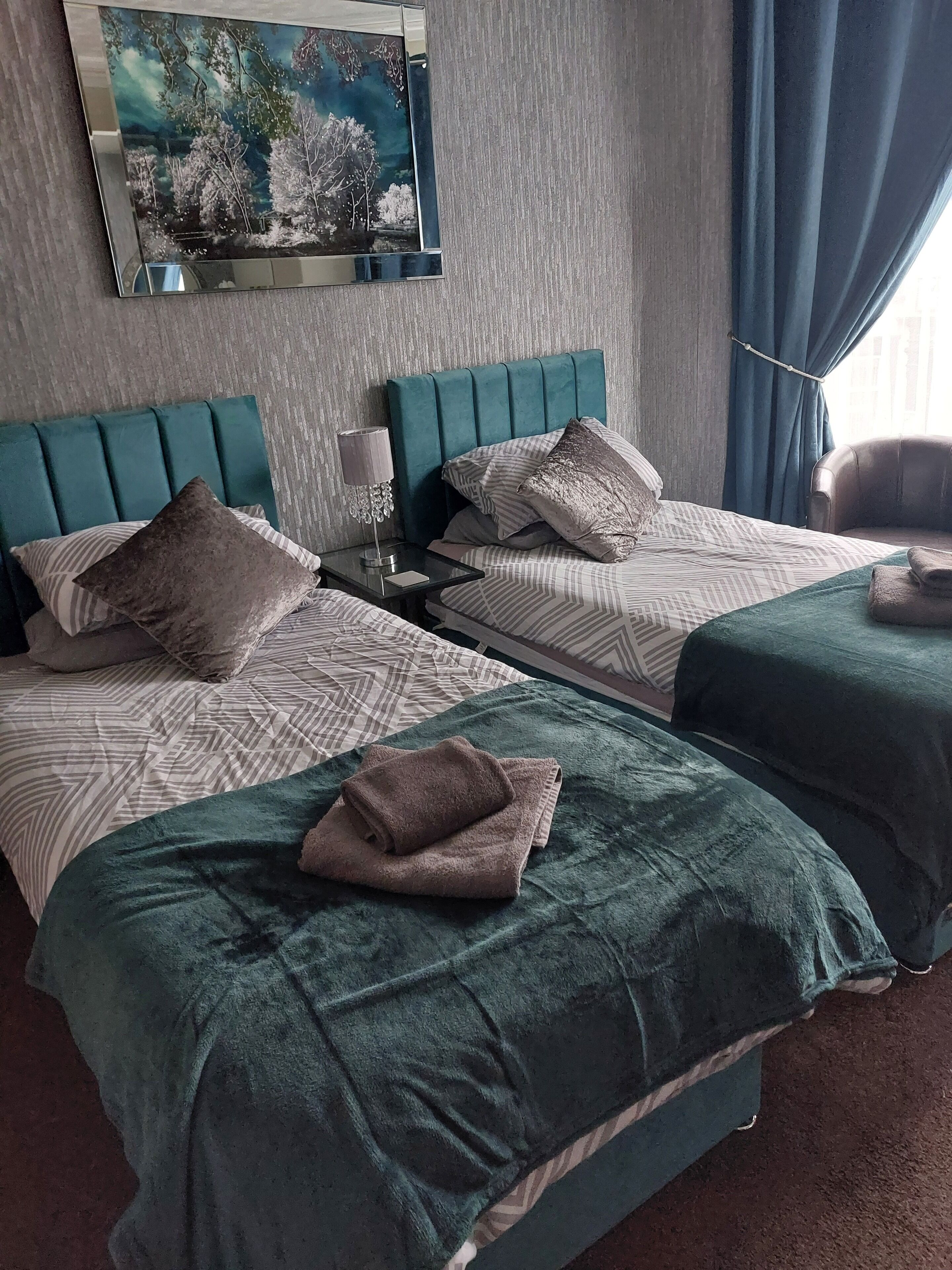 room 3 | laptop workspace, blackout curtains, iron/ironing board, travel cot