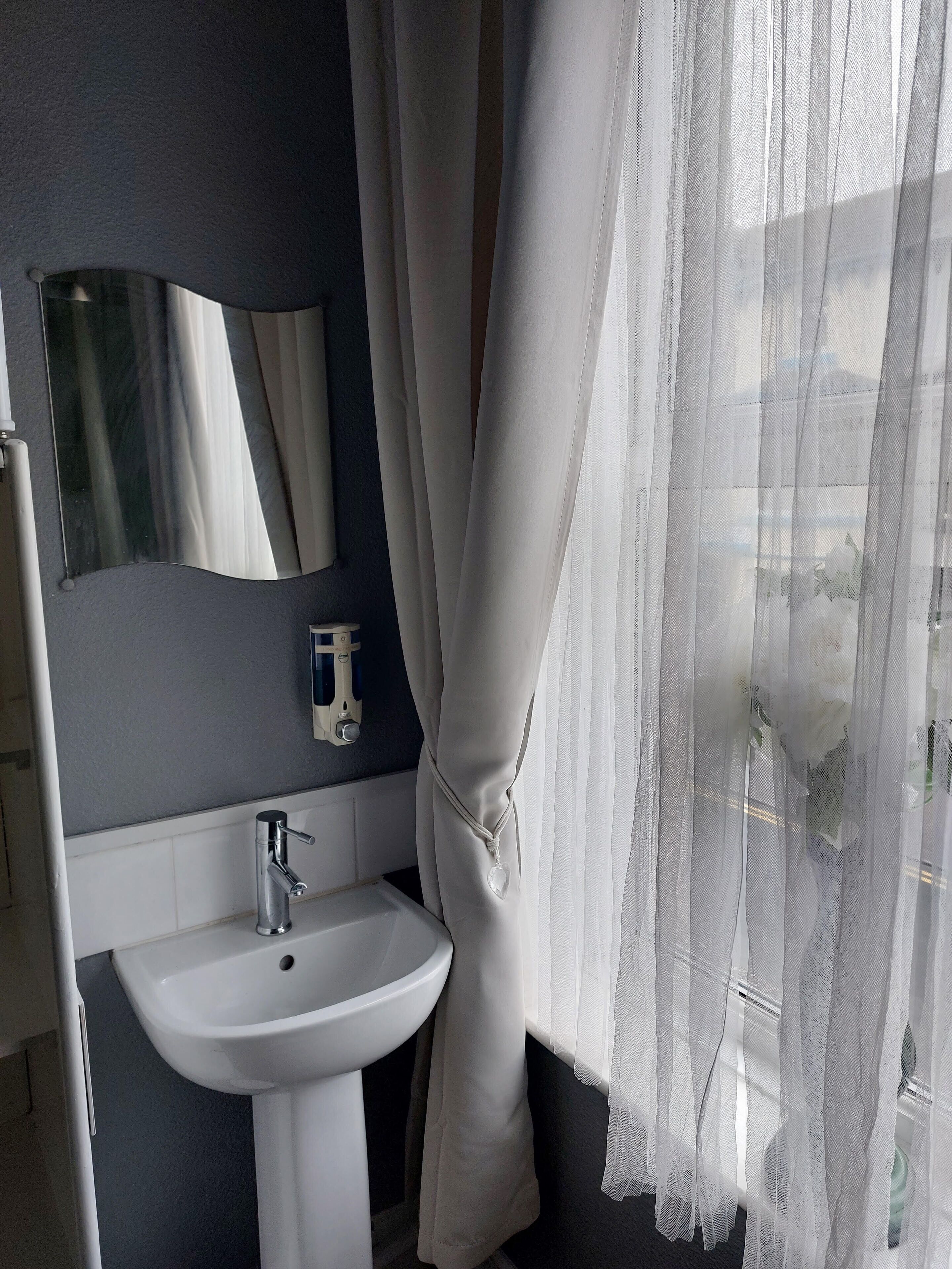 room 4 | laptop workspace, blackout curtains, iron/ironing board, travel cot