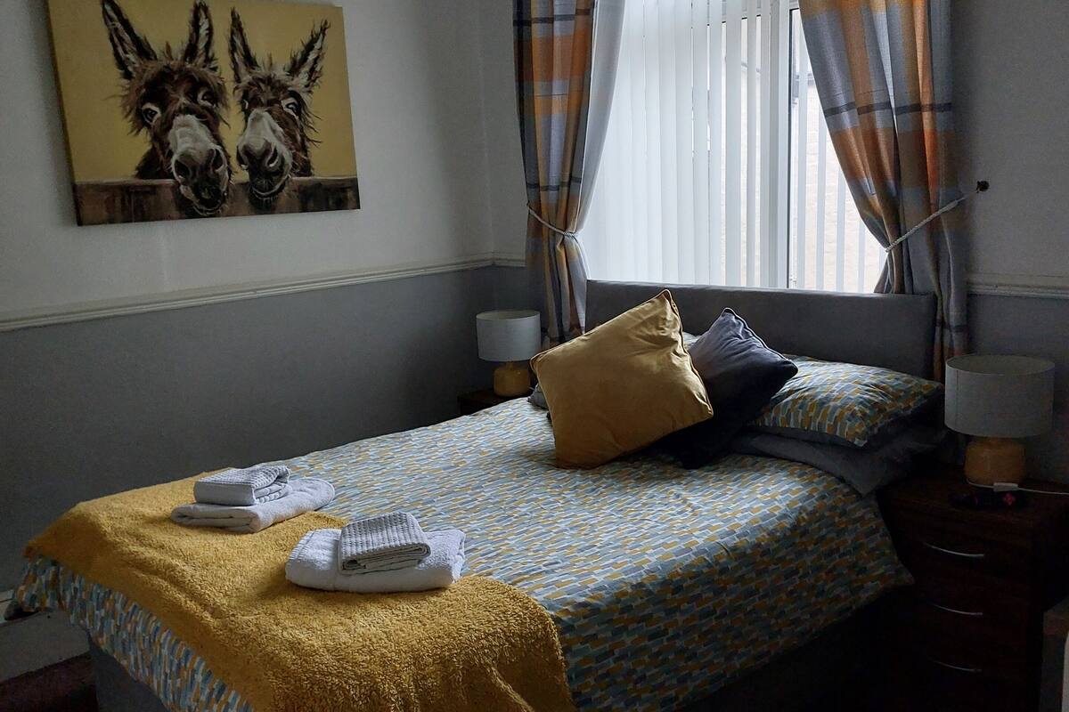 Room 2 | Laptop workspace, blackout drapes, iron/ironing board, travel crib