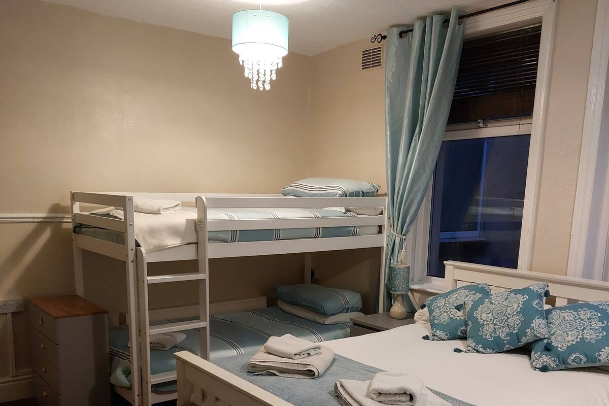 Room 1 | Laptop workspace, blackout drapes, iron/ironing board, travel crib