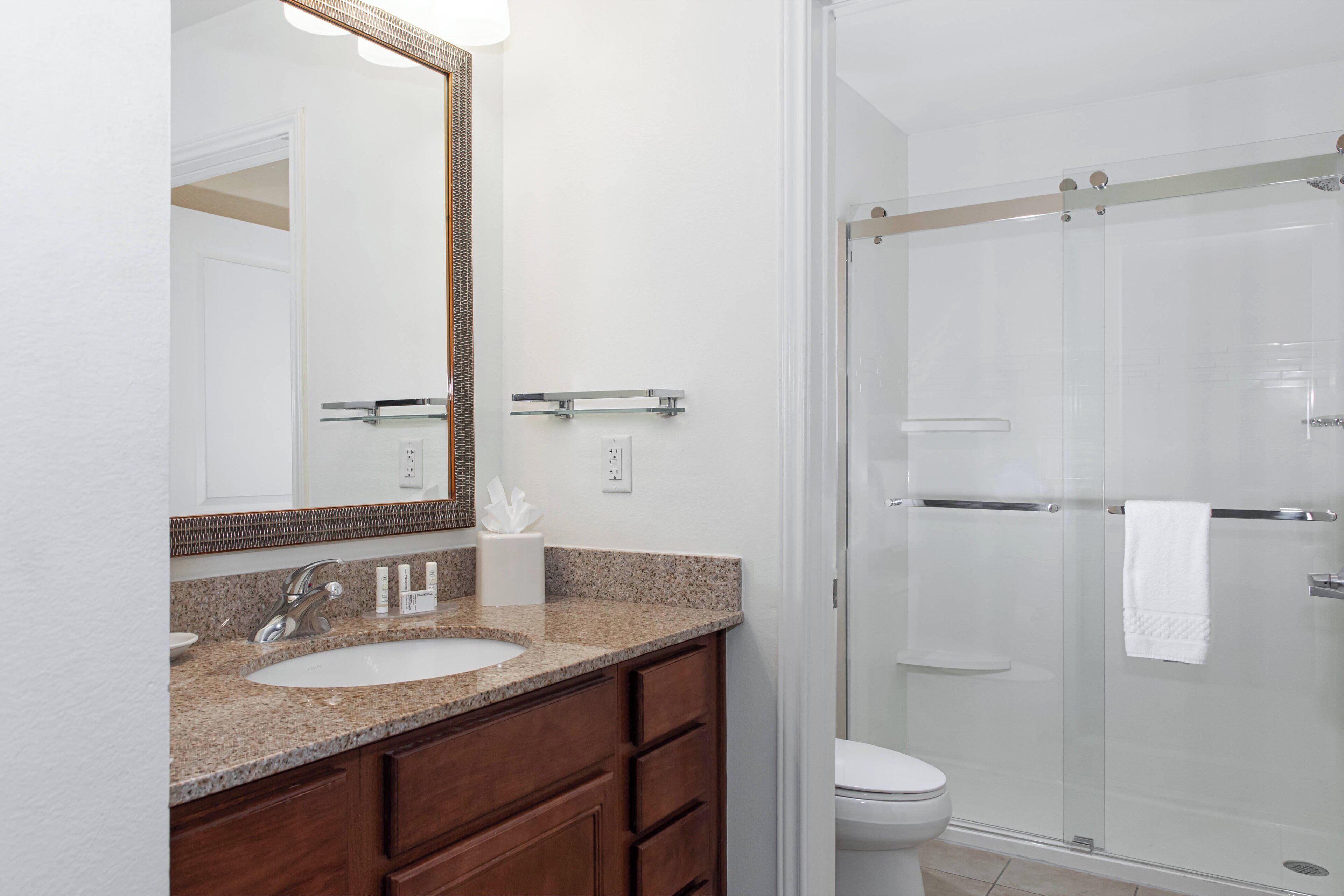 shower, designer toiletries, hair dryer, towels