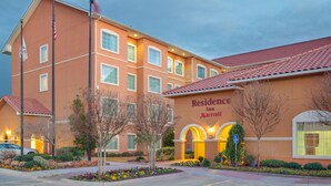 A multi-story hotel with a red-tiled roof and a sign reading "Residence Inn Marriott". - Residence Inn by Marriott Midland (Midland)