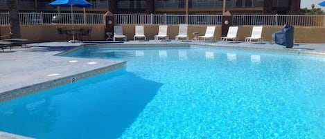 Seasonal outdoor pool, pool loungers