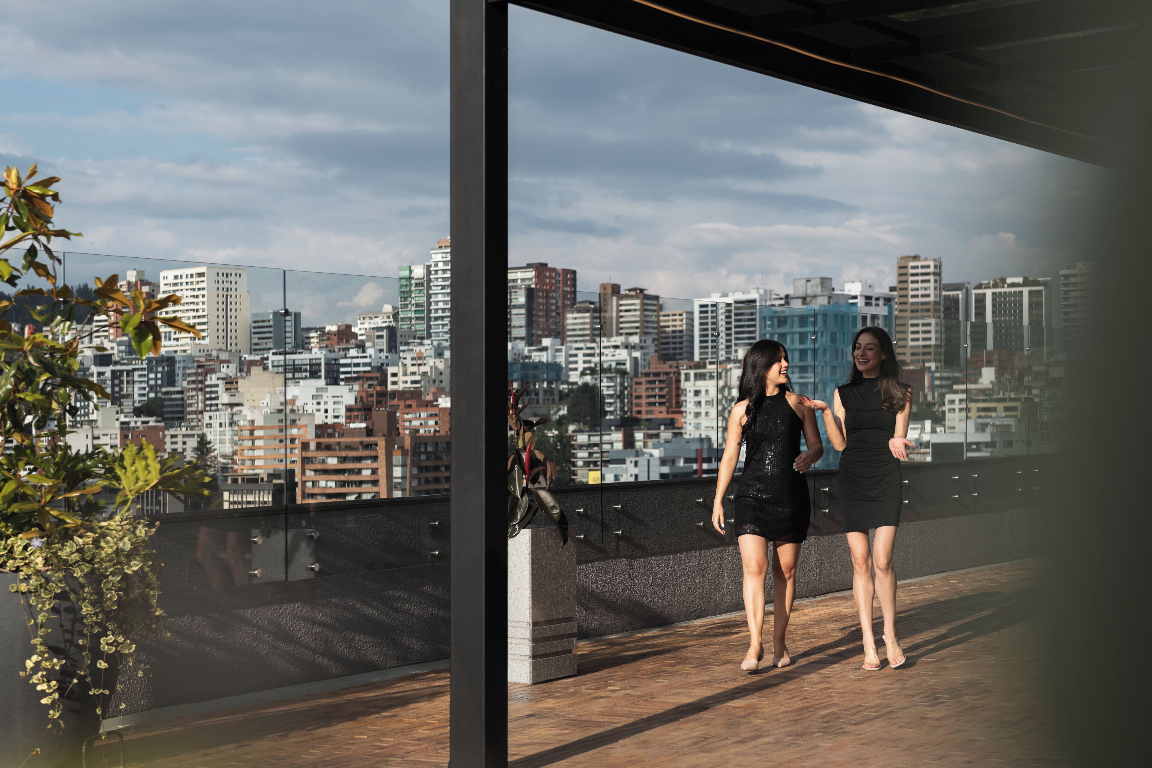 A cityscape view from a high-rise building with a modern architectural design.