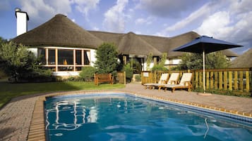 Outdoor pool, open 7:00 AM to 7:00 PM, pool loungers