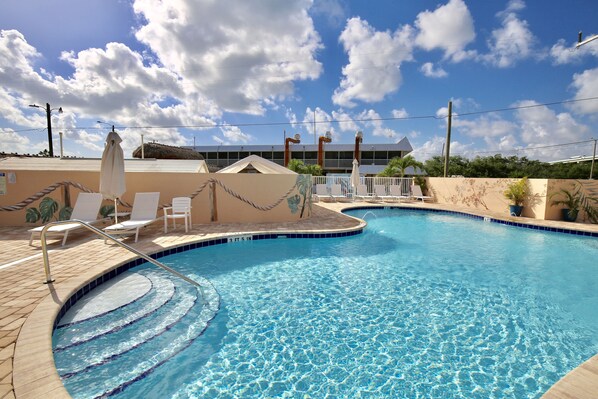 Outdoor pool, open 8 AM to 8 PM, pool umbrellas, sun loungers