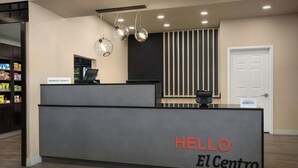 A reception desk with a sign reading "HELLO El Centro". - TownePlace Suites Marriott El Centro (El Centro)