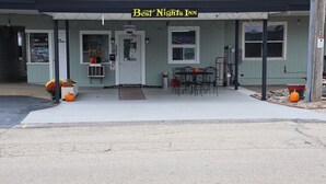 A building with a sign reading "Best Nights Inn" and a door labeled "Office."