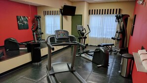 A gym with a treadmill, exercise bike, and various other fitness equipment. - Country Inn & Suites by Radisson, Tallahassee-University Area, FL (Tallahassee)