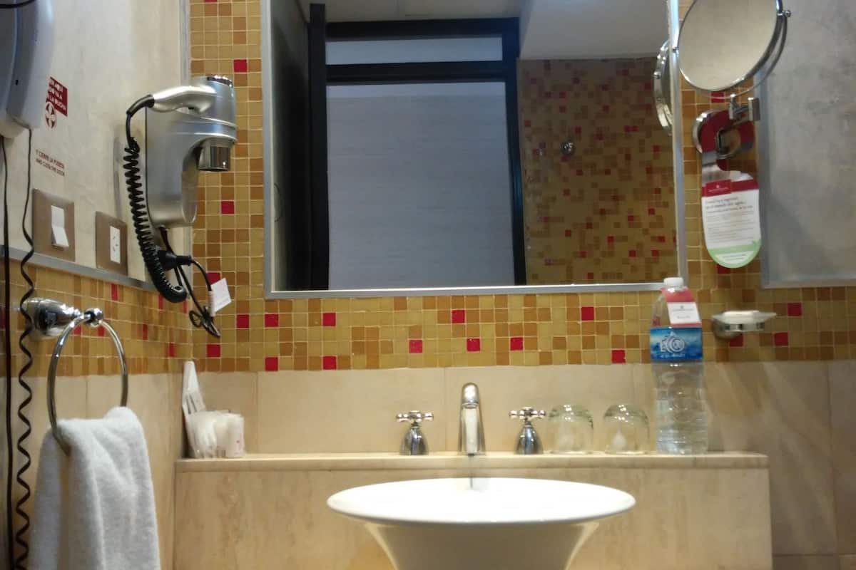 double room, river view | bathroom sink