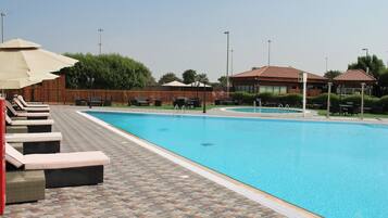 Outdoor pool, pool umbrellas, sun loungers