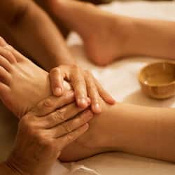 Expertly administered foot massage with gentle strokes and soothing care.