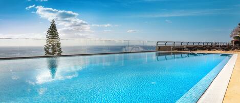 Indoor pool, outdoor pool, open 9:00 AM to 6:00 PM, pool umbrellas