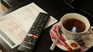 Superior Double Room Single Use | Living area | 50-inch Smart TV with cable channels, TV, toys