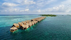 An overwater bungalow resort with multiple levels of thatched-roof structures extending into the turquoise sea. - Adaaran Select Huduran Fushi - with 24hrs Premium All Inclusive (Lhohifushi)