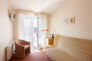 Superior Double or Twin Room | Living area | TV