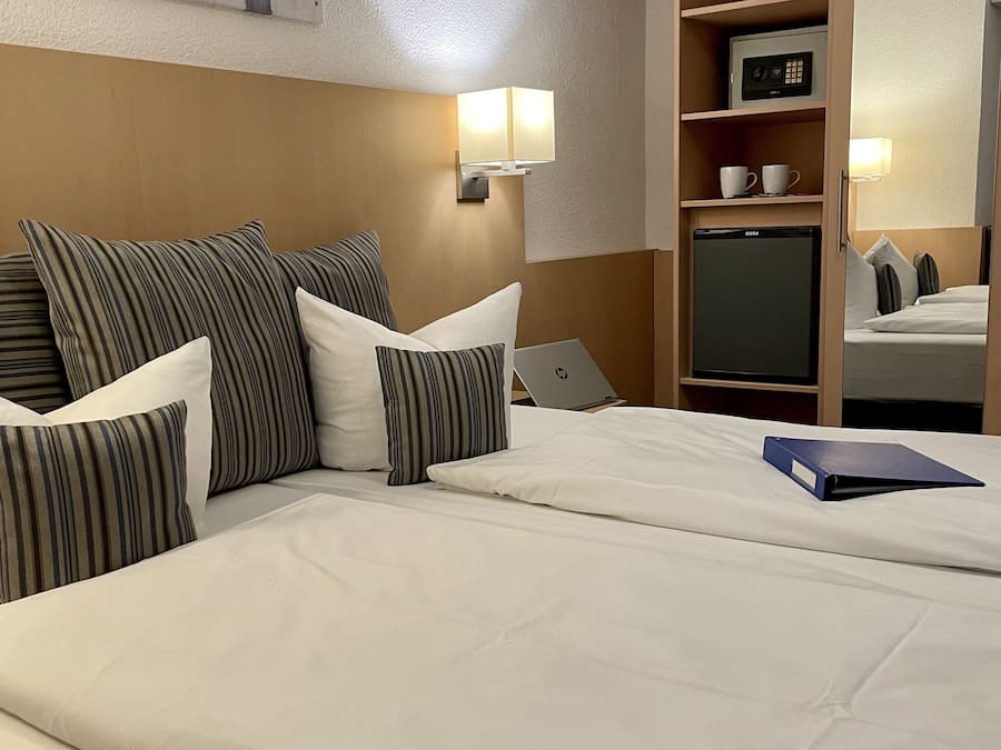 Hypo-allergenic bedding, down comforters, minibar, in-room safe