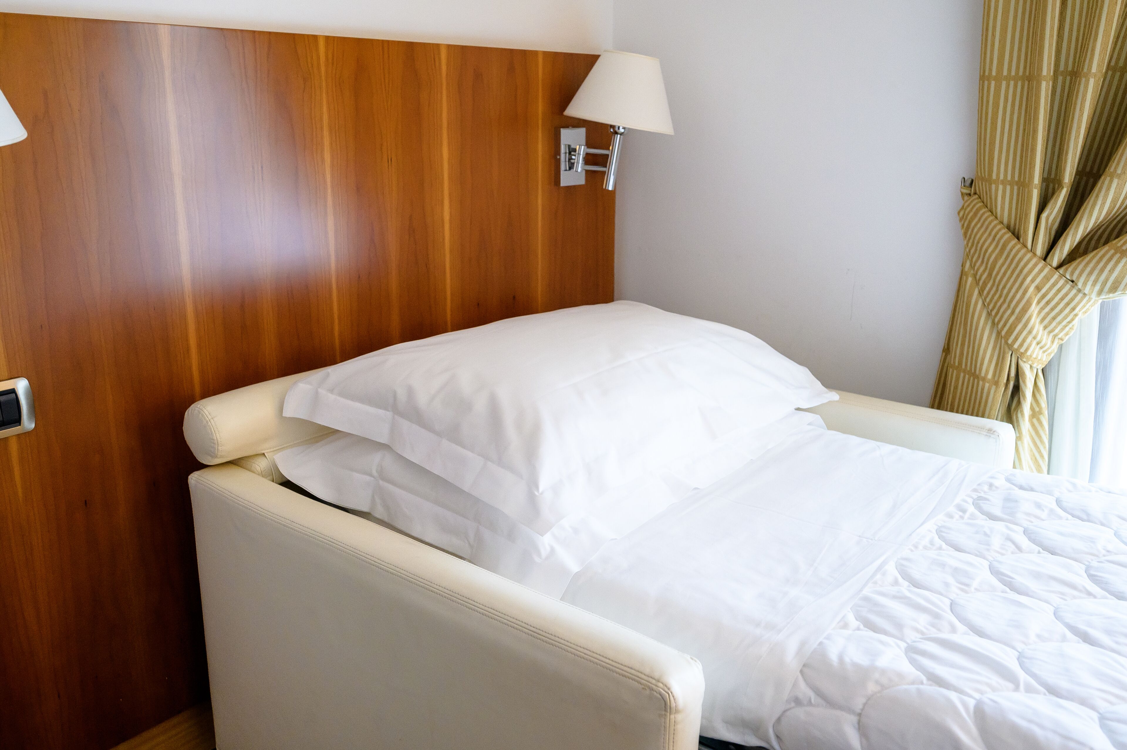 deluxe triple room | minibar, in-room safe, desk, laptop workspace