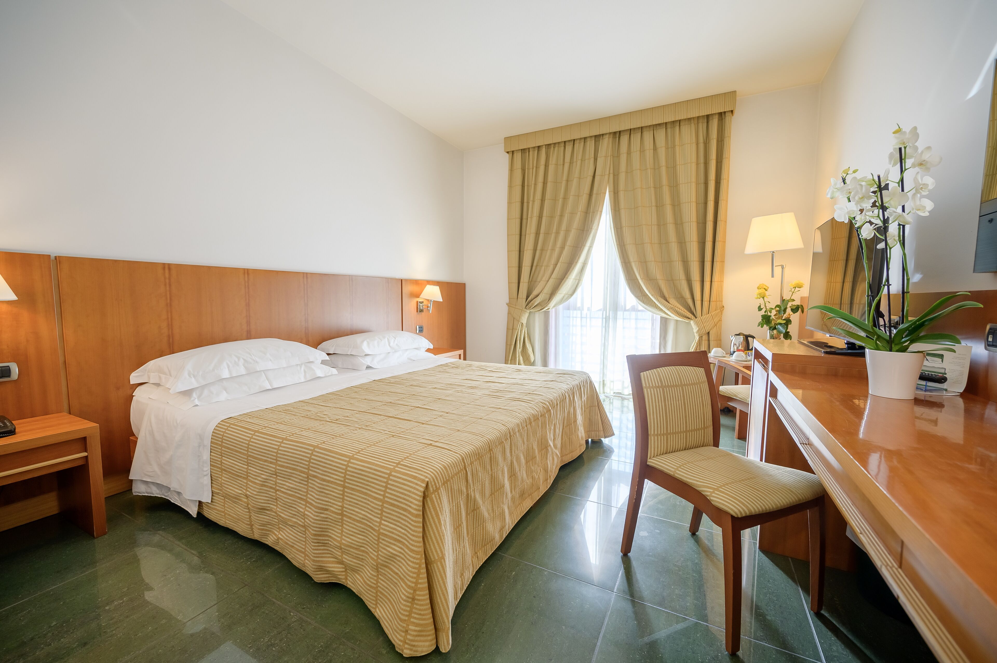 superior triple room | minibar, in-room safe, desk, laptop workspace