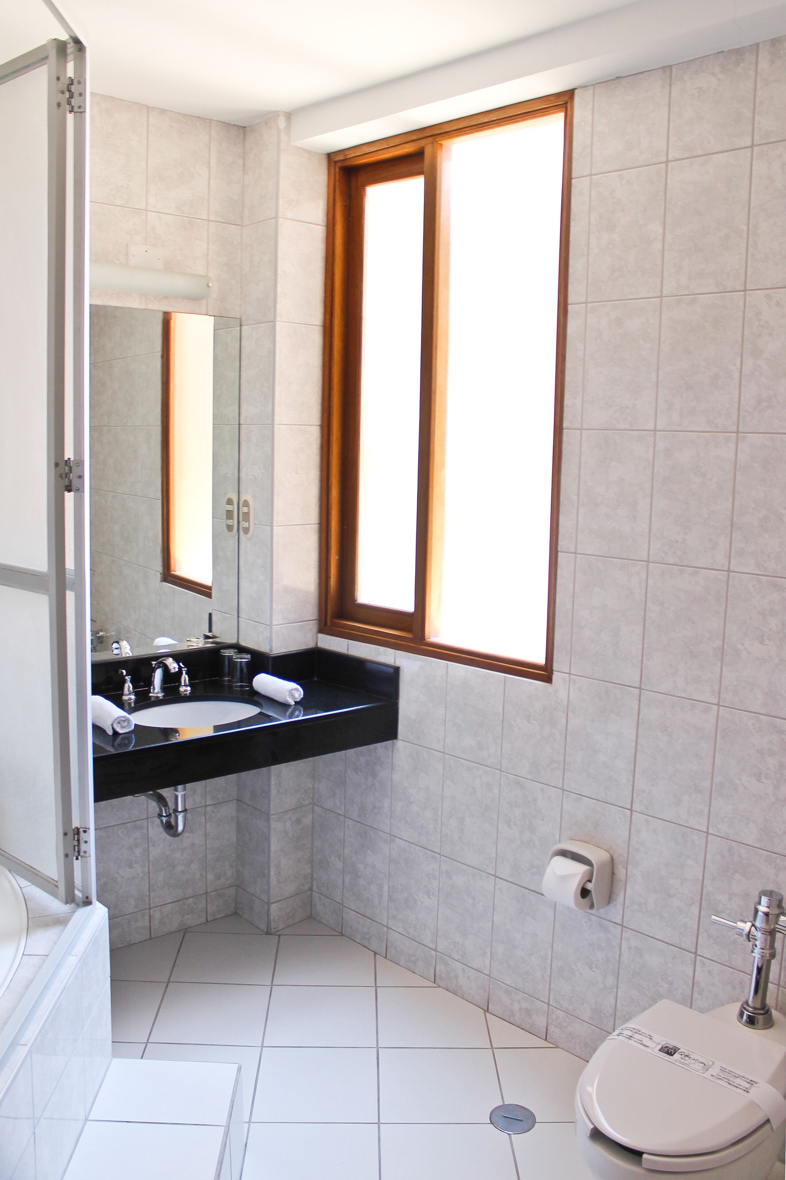 standard twin room, 2 double beds | bathroom | rainfall showerhead, free toiletries, hair dryer, bidet