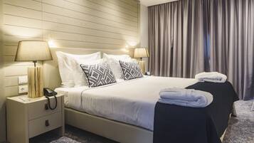 Hypo-allergenic bedding, down duvets, minibar, in-room safe