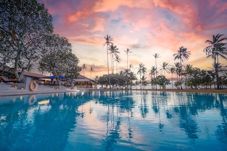 Outdoor pool, open 7:00 AM to 7:00 PM, pool umbrellas, sun loungers