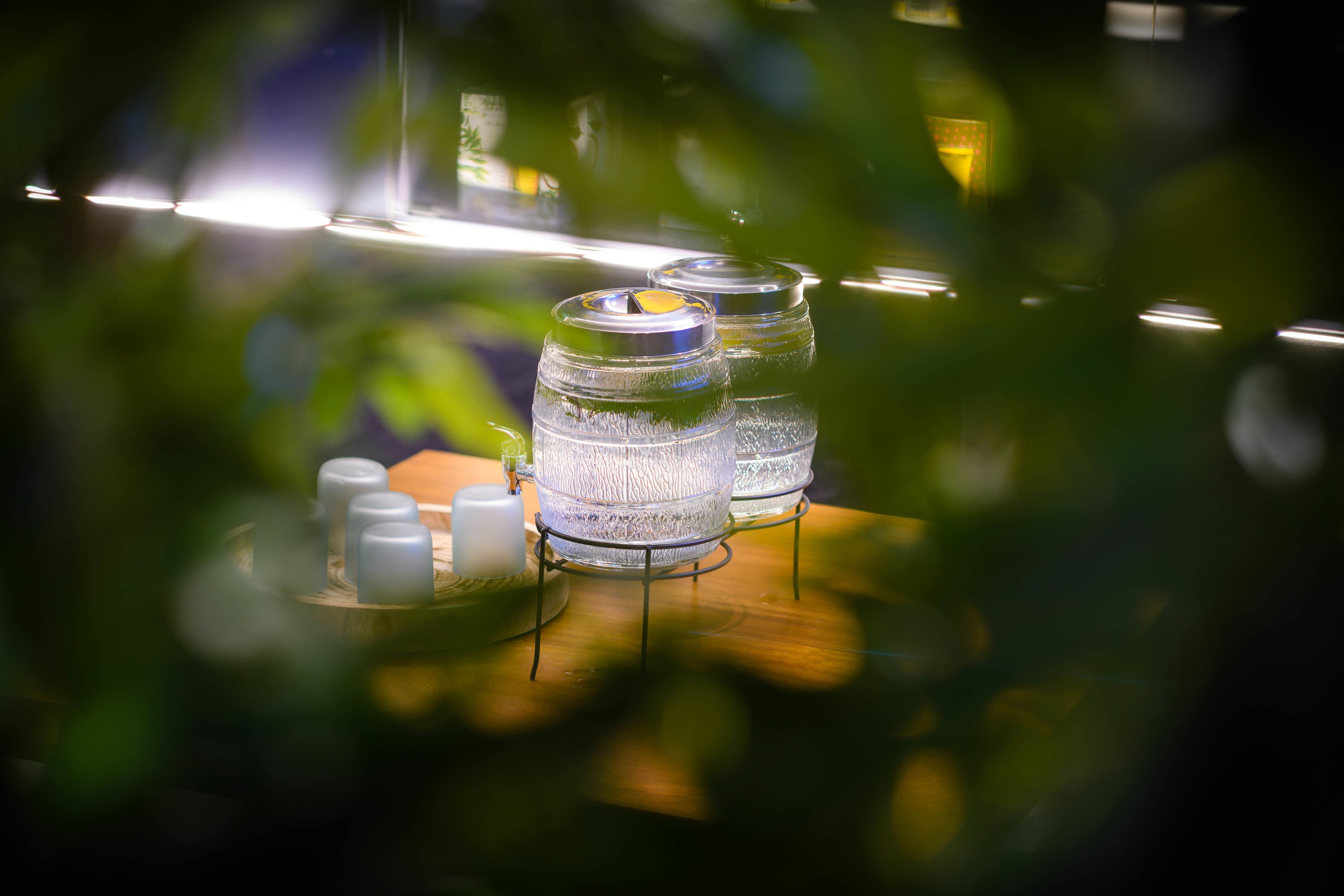 A table with glass jars and salt shakers.