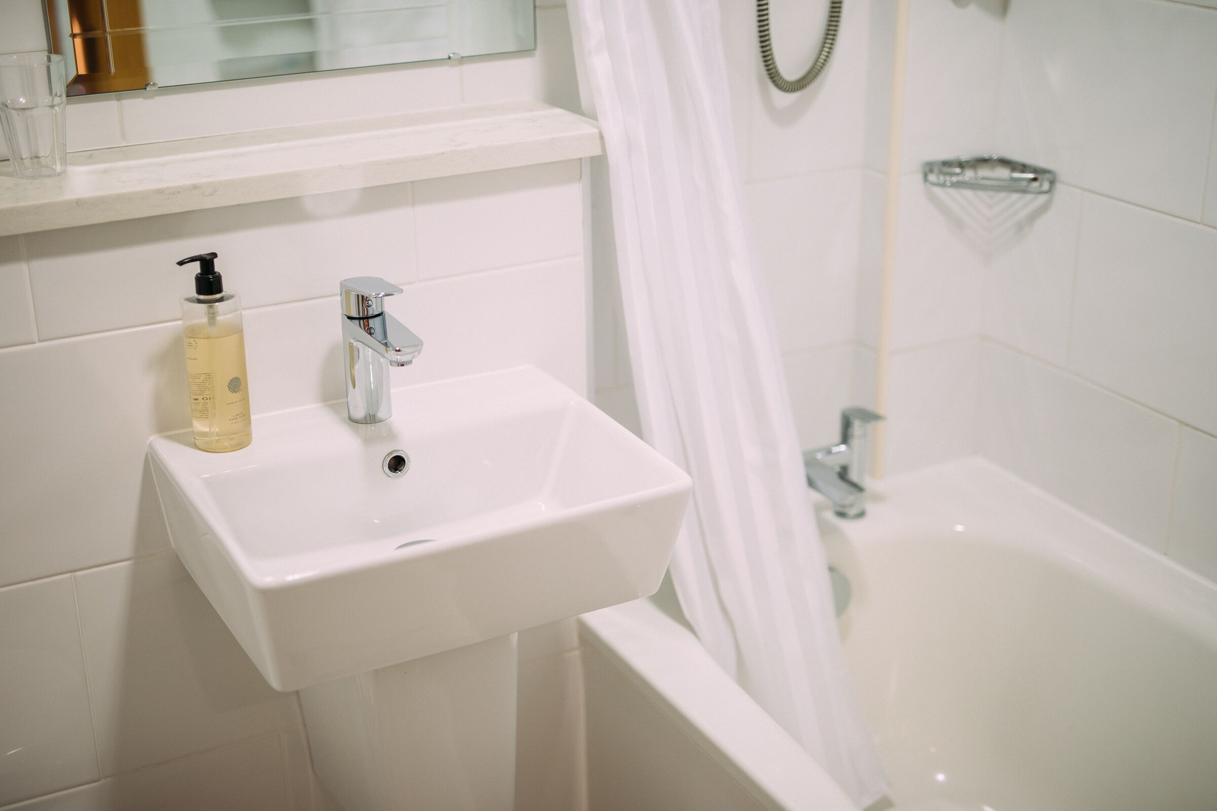 classic double room | bathroom | separate bathtub and shower, hair dryer, towels, soap