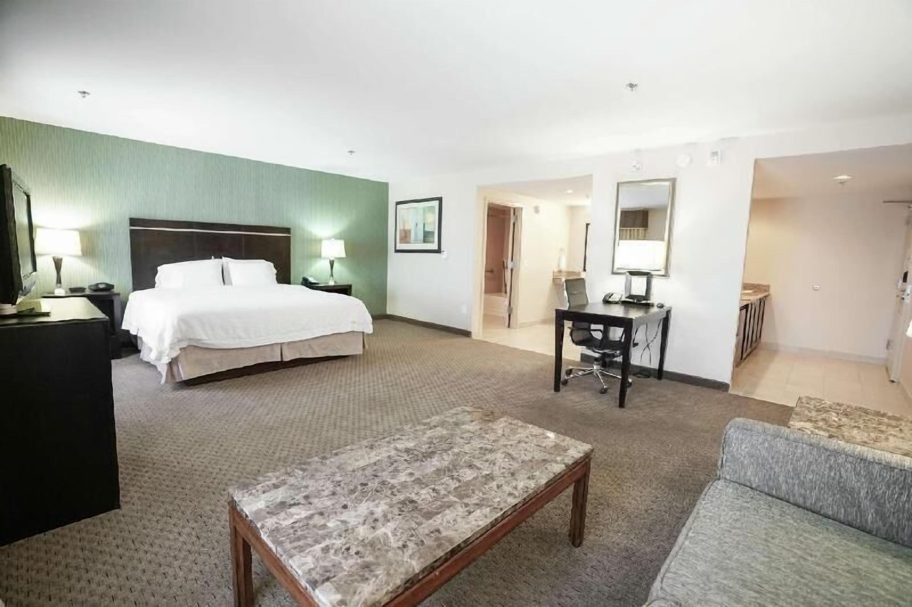 Down comforters, desk, blackout drapes, iron/ironing board