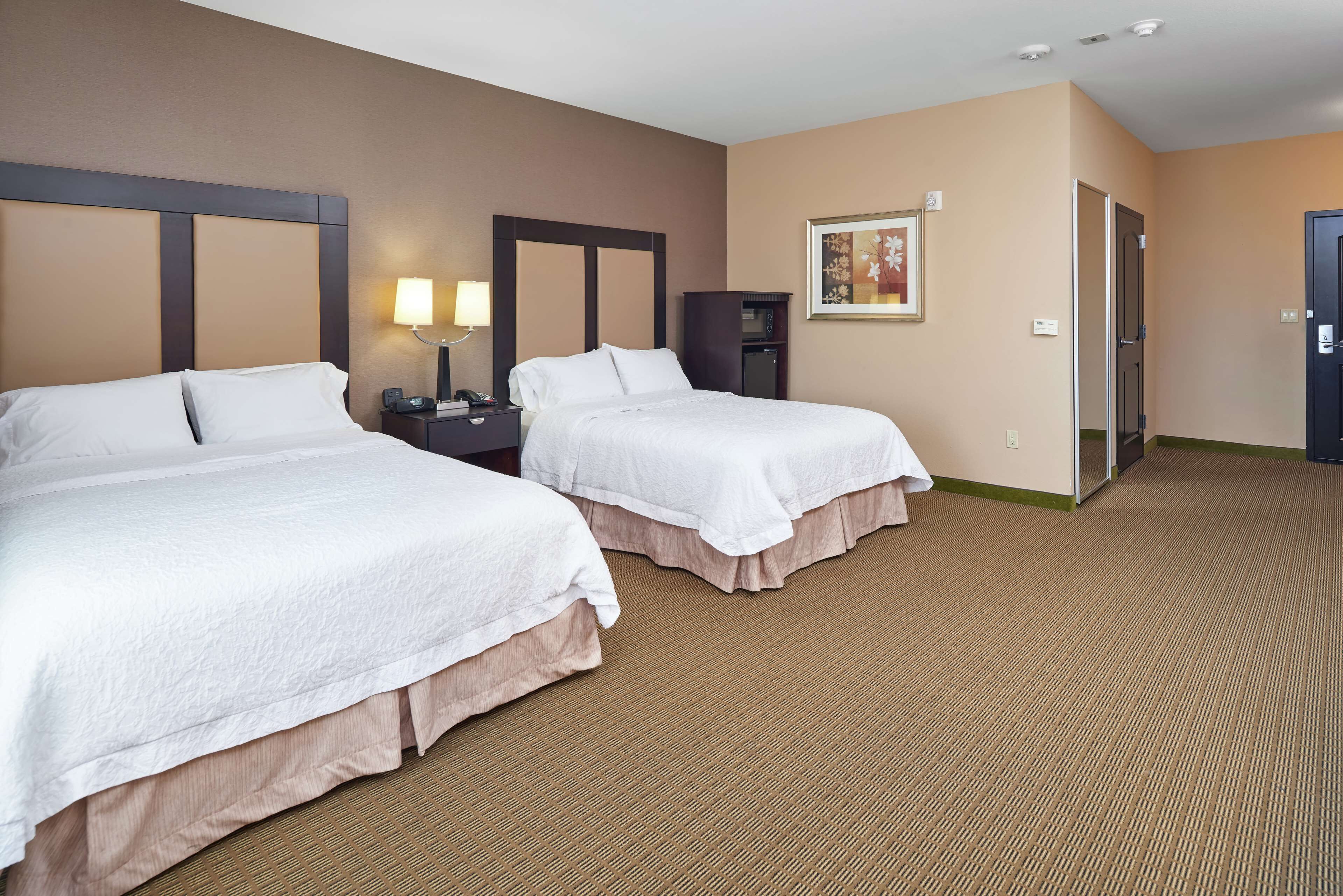 suite, two queen beds, non-smoking | in-room safe, desk, laptop workspace, blackout curtains