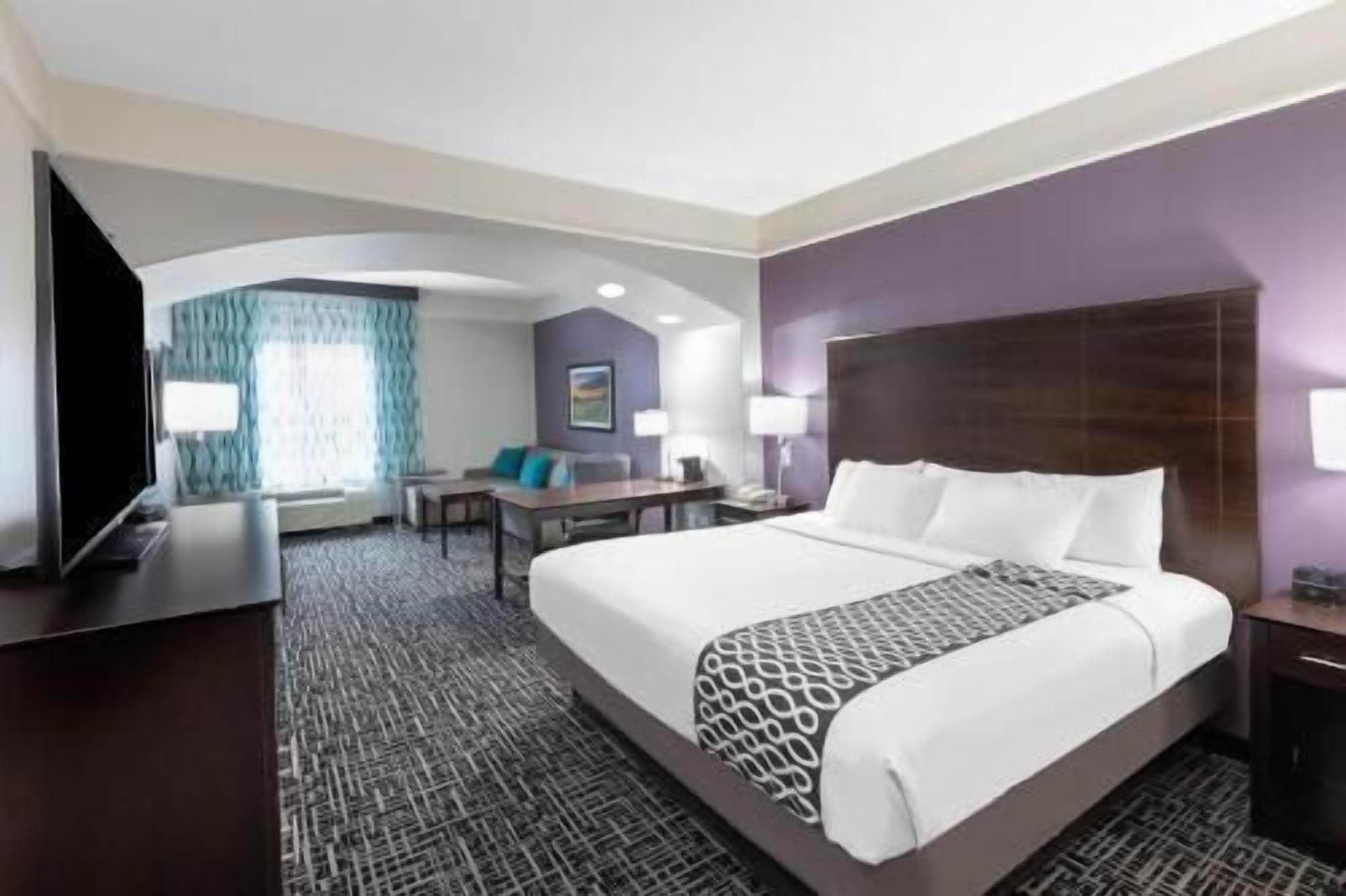 Premium bedding, desk, laptop workspace, blackout curtains