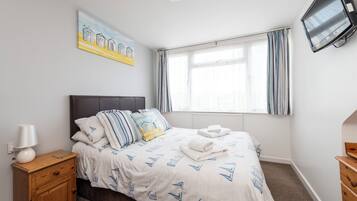 Premium bedding, blackout drapes, iron/ironing board, free WiFi