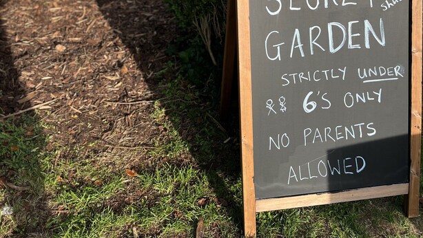 A sign that reads "SECRET GARDEN" with a note "Strictly under 6's only, no parents allowed." - Thorverton Arms (Exeter)