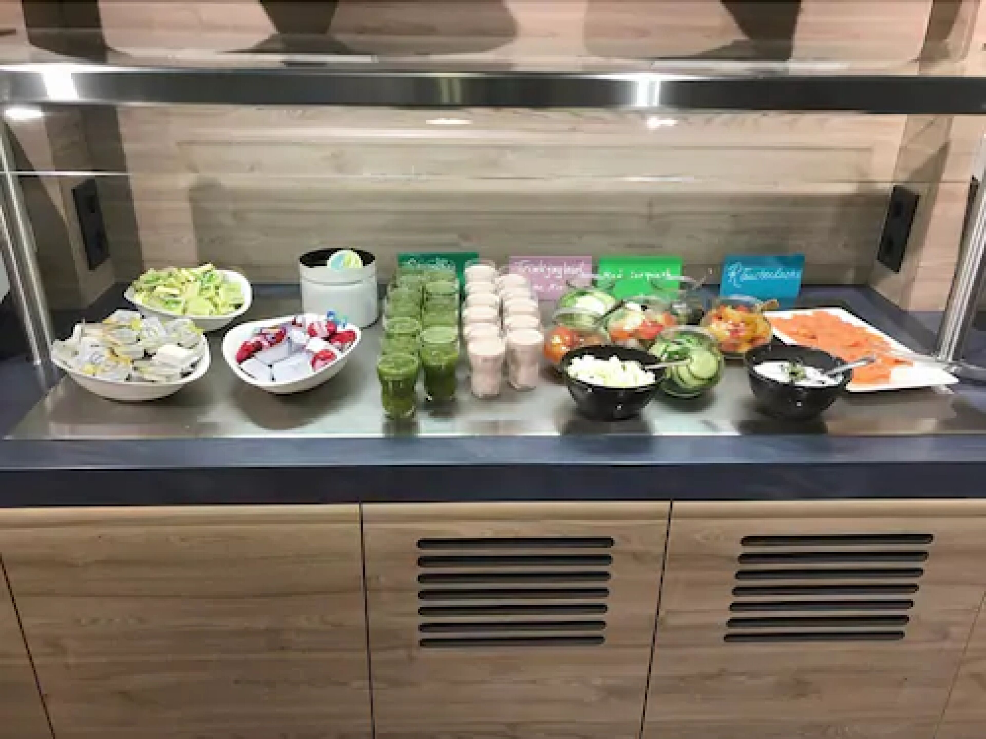 A buffet with various food and drink options.